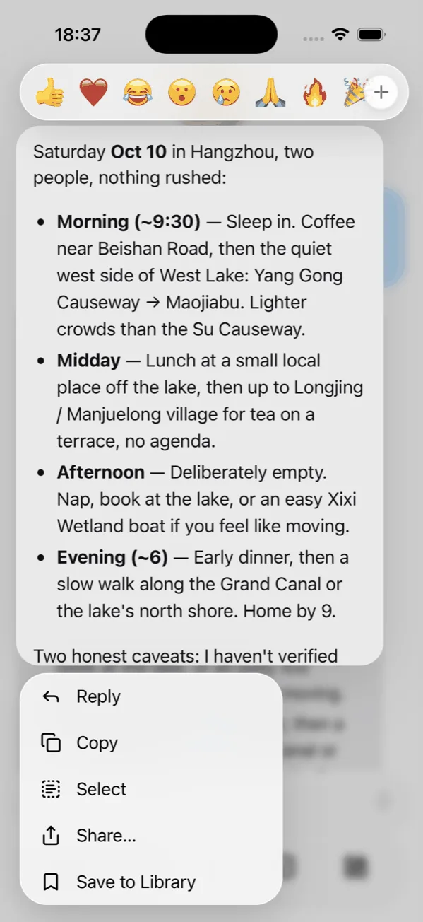 Long-press menu on a reply with reactions, Reply, Copy, Select, Share and Save to Library